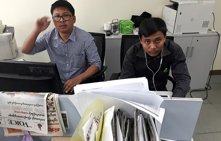 Reuters journalists Wa Lone, left, and Kyaw Soe Oo, face up to 14 years in prison for their reporting in Myanmar. (Reuters/Antoni Slodkowski)