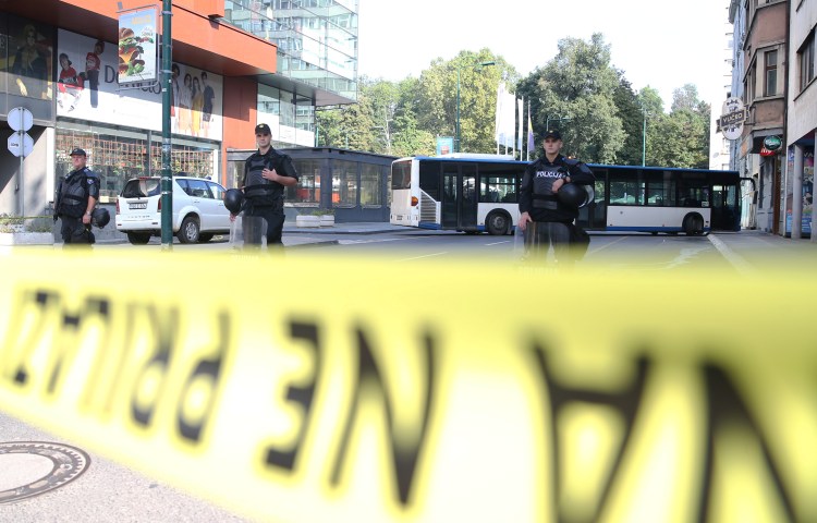 Special Police officers stand on a road they have sealed off with yellow tape in Sarajevo, Bosnia and Herzegovina, on September 8, 2019.